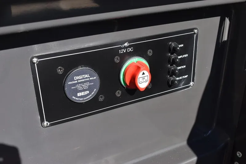 Slide: The Image of Control panel of 2023 Monterey 255SS boat with digital voltage display. - 49