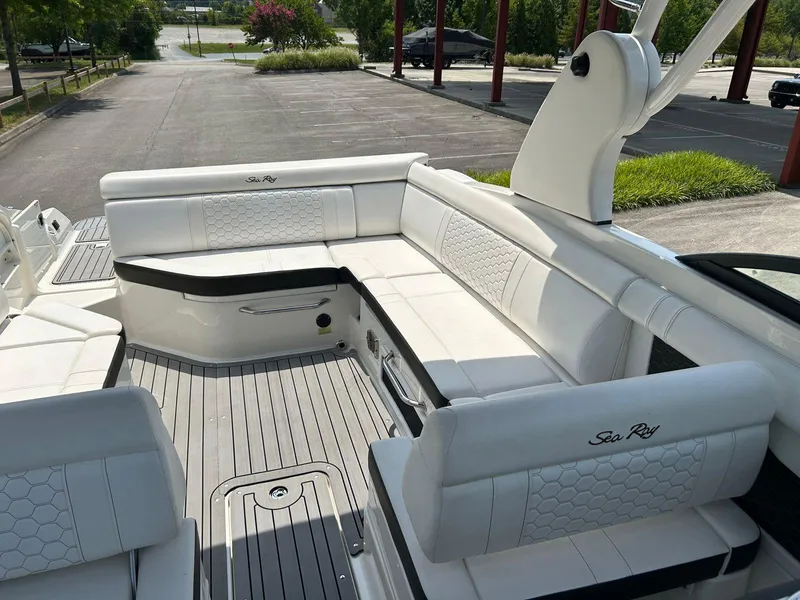 Slide: The Image of 2019 Sea Ray 270 SDX boat with spacious white seating and sleek design. - 10