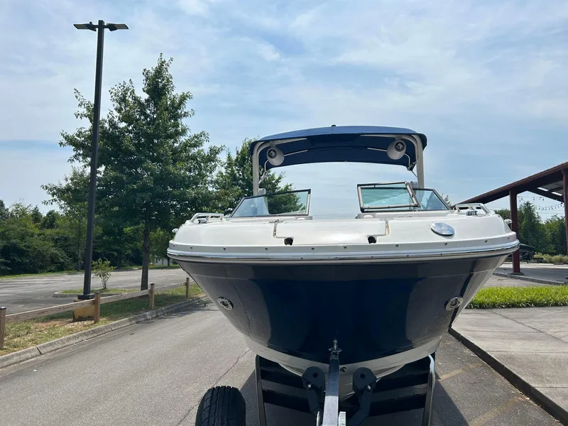 Slide: The Image of 2019 Sea Ray 270 SDX boat on trailer, parked outdoors. - 14