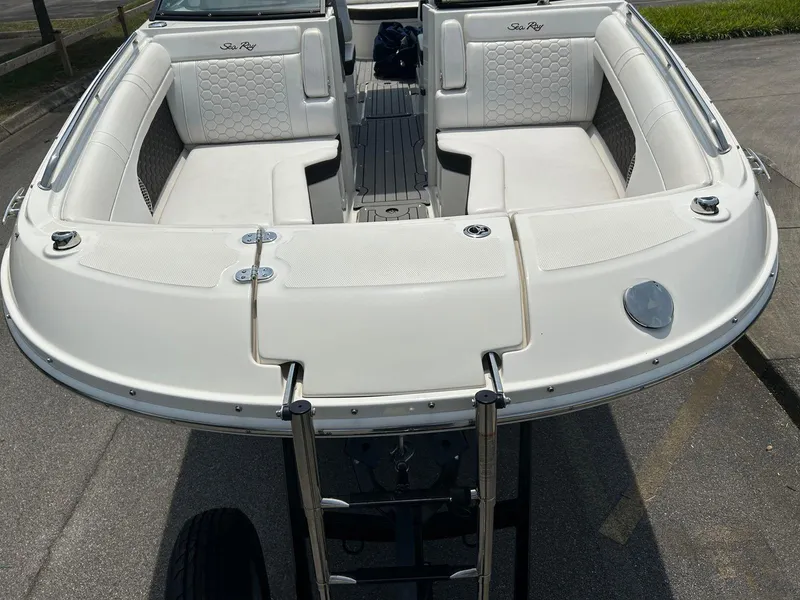 Slide: The Image of 2019 Sea Ray 270 SDX boat with spacious seating and sleek design. - 16