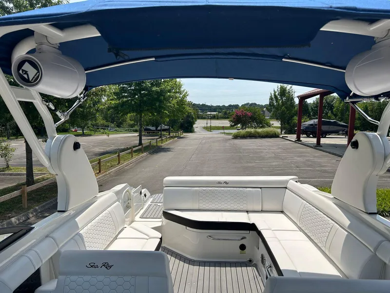 Slide: The Image of 2019 Sea Ray 270 SDX boat with spacious seating and blue canopy. - 6