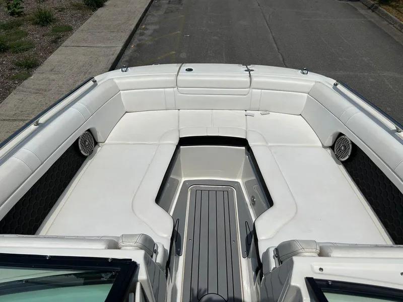 Slide: The Image of 2019 Sea Ray 270 SDX boat with spacious white seating and sleek design. - 7