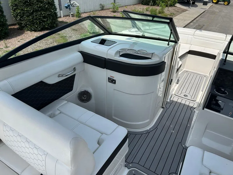 Slide: The Image of 2019 Sea Ray 270 SDX boat interior with white seating and sleek design. - 9