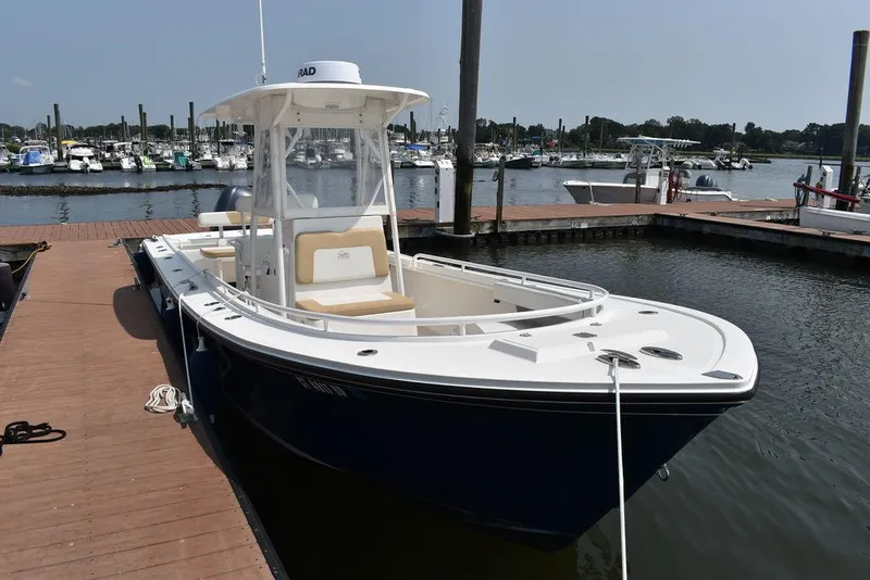 Slide: The Image of 2015 Steiger Craft 255 Center Console boat docked at marina. - 11