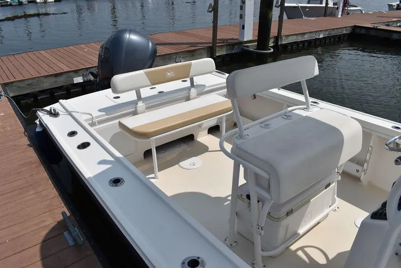 Slide: The Image of 2015 Steiger Craft 255 Center Console boat interior at dock. - 14