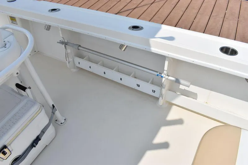 Slide: The Image of 2015 Steiger Craft 255 Center Console boat interior with rod holders and seating. - 16