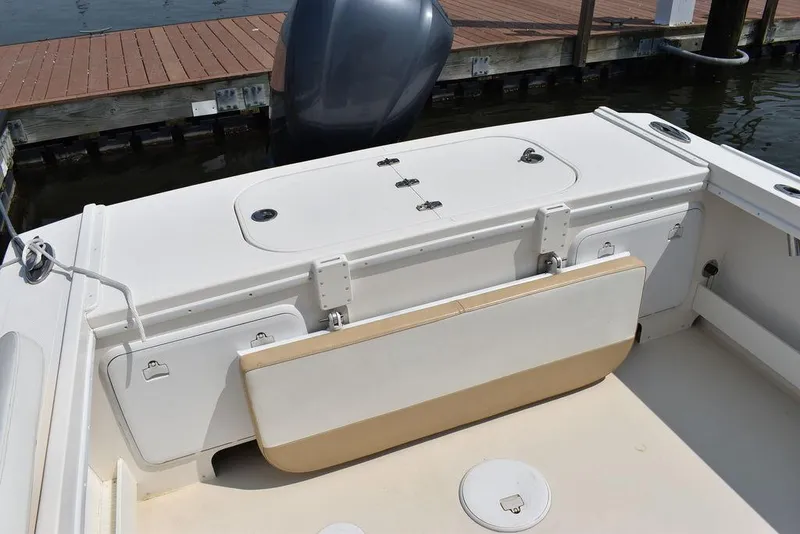 Slide: The Image of 2015 Steiger Craft 255 Center Console boat interior with seating and storage. - 21