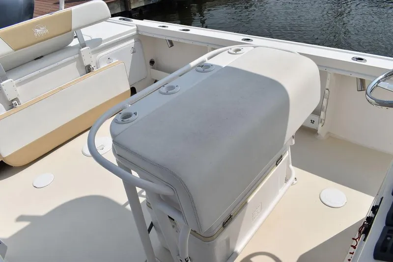Slide: The Image of 2015 Steiger Craft 255 Center Console boat interior with seating and storage. - 24