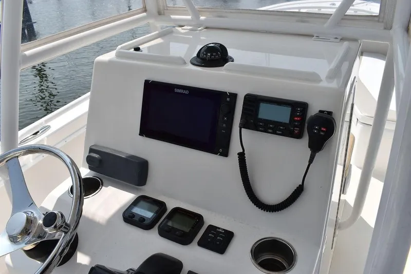 Slide: The Image of Steiger Craft 255 Center Console 2015 dashboard with navigation and communication equipment. - 27