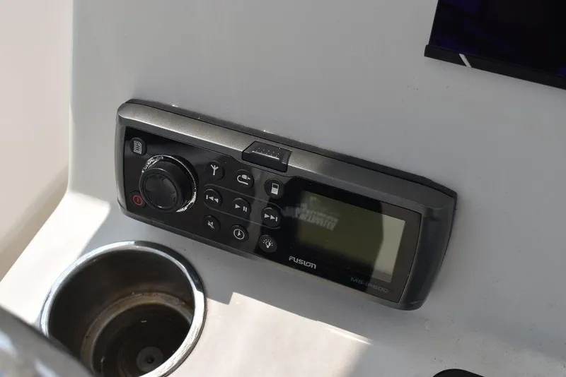 Slide: The Image of Fusion marine stereo on 2015 Steiger Craft 255 Center Console dashboard. - 31