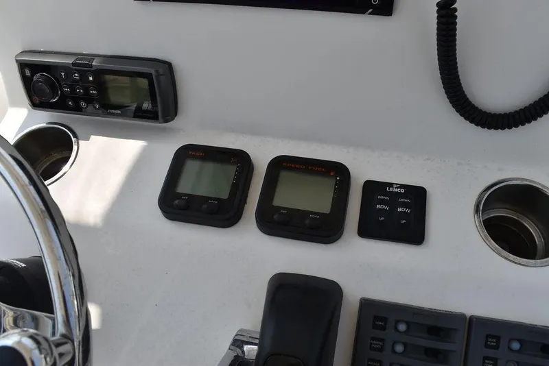 Slide: The Image of Steiger Craft 255 Center Console 2015 dashboard with electronic controls and gauges. - 32