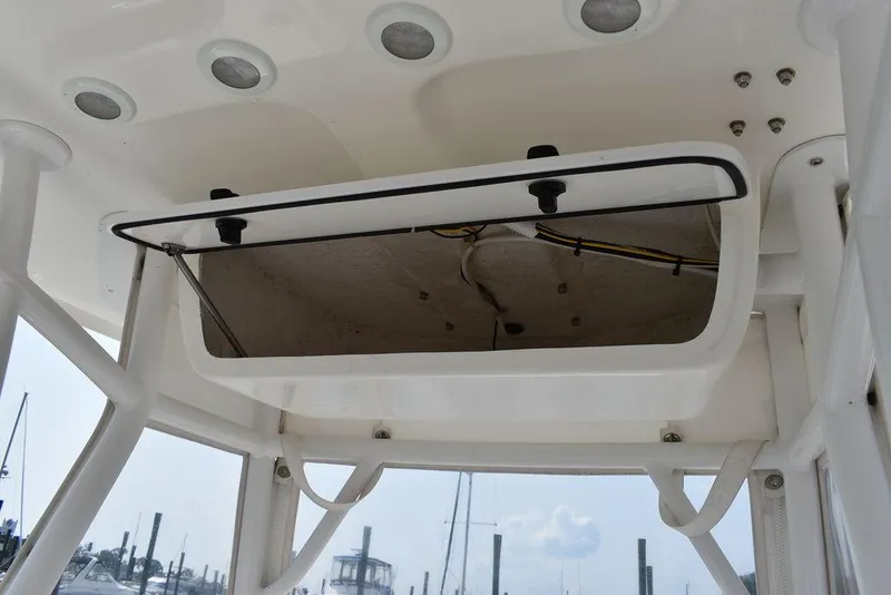 Slide: The Image of 2015 Steiger Craft 255 Center Console storage compartment with open hatch. - 34