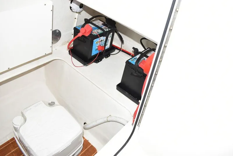 Slide: The Image of 2015 Steiger Craft 255 Center Console boat battery compartment with dual batteries. - 39