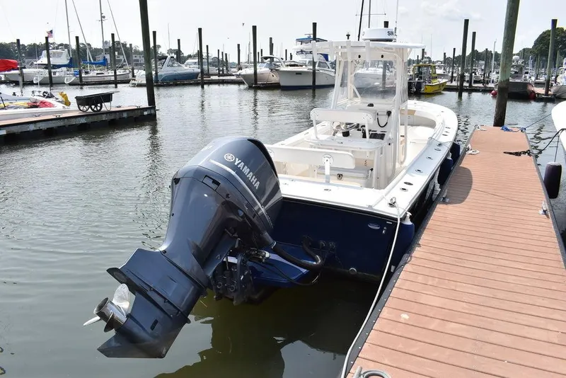 Slide: The Image of 2015 Steiger Craft 255 Center Console boat docked with Yamaha outboard engine. - 4