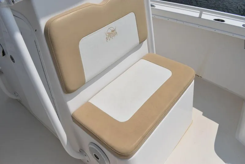 Slide: The Image of 2015 Steiger Craft 255 Center Console beige and white cushioned seat. - 41