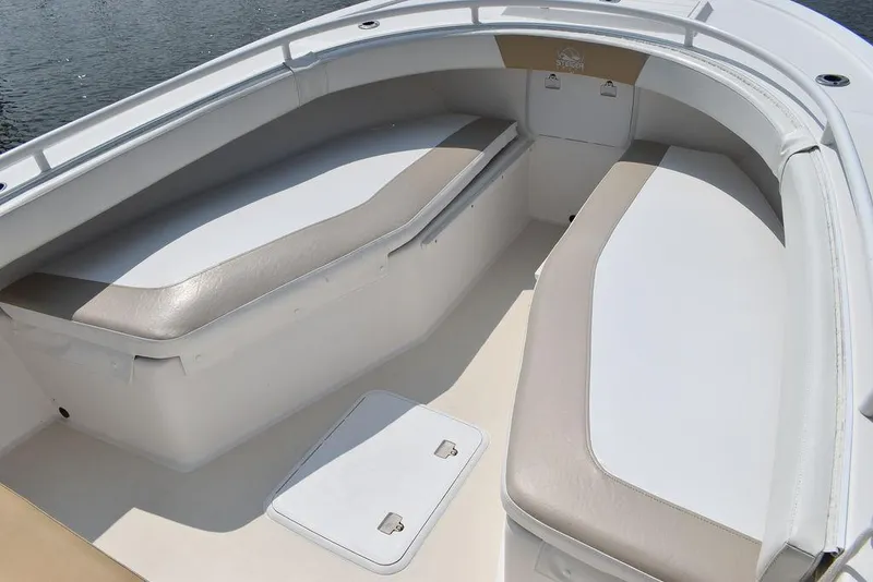 Slide: The Image of 2015 Steiger Craft 255 Center Console boat interior with cushioned seating. - 44