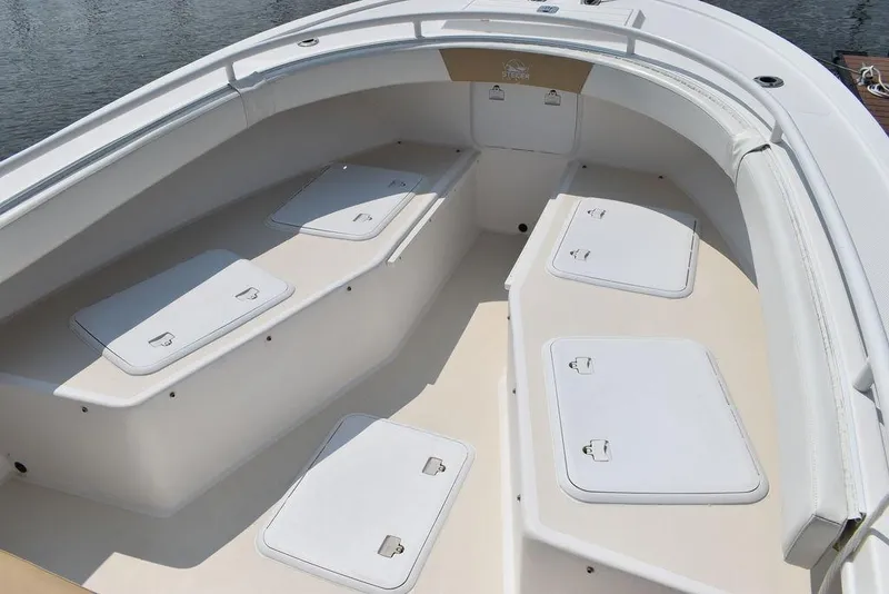 Slide: The Image of 2015 Steiger Craft 255 Center Console boat interior with storage compartments. - 45