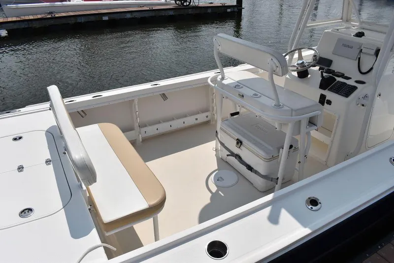 Slide: The Image of 2015 Steiger Craft 255 Center Console boat interior with seating and console. - 6