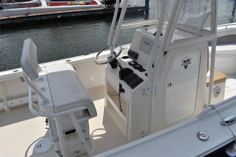 Slide: The Image of 2015 Steiger Craft 255 Center Console boat interior with helm and seating. - 8