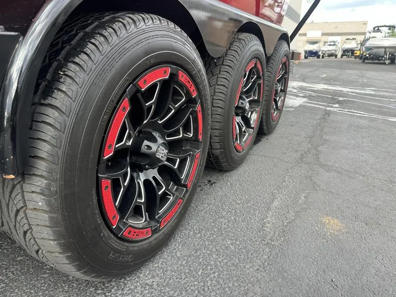Slide: The Image of 2021 Malibu M240 trailer with stylish black and red wheels. - 10