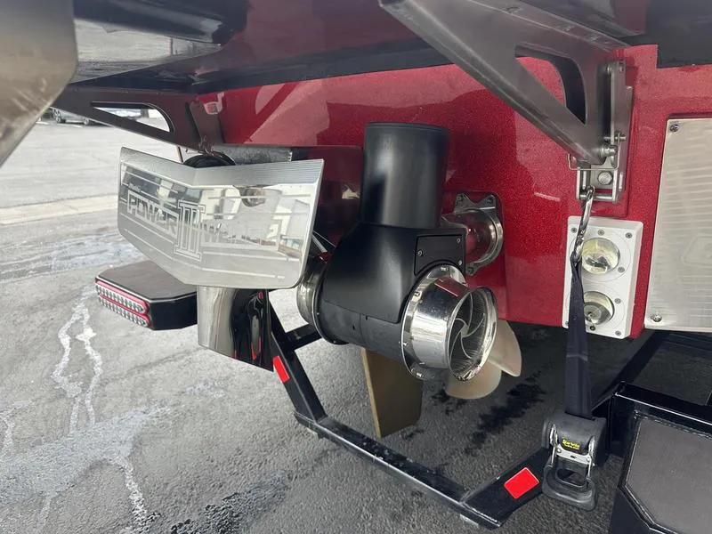 Slide: The Image of 2021 Malibu M240 boat propeller and rudder system, close-up view. - 14