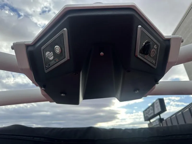 Slide: The Image of 2021 Malibu M240 boat speaker system under cloudy sky. - 2