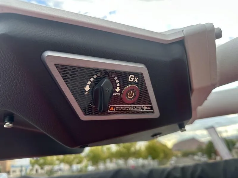 Slide: The Image of 2021 Malibu M240 control panel with adjustment knob and power button. - 27