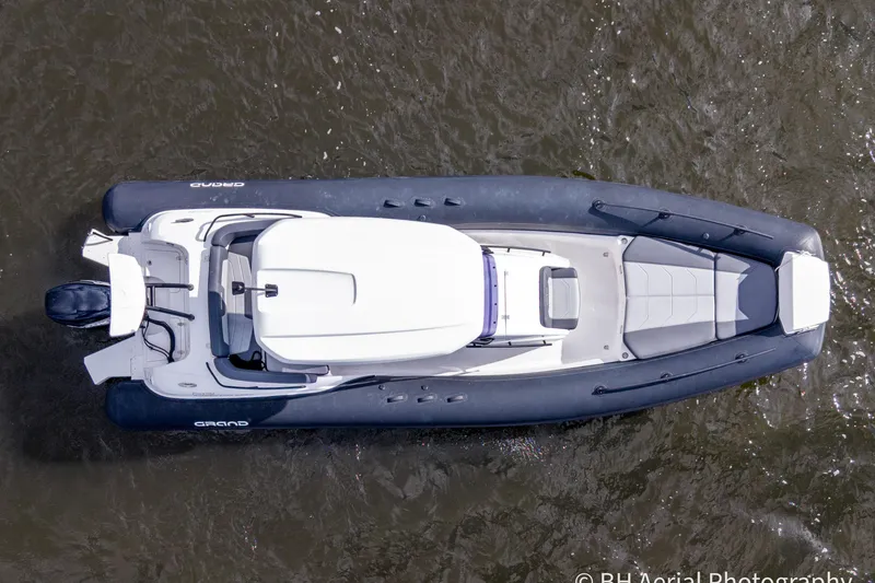 Slide: The Image of Overhead view of 2025 Grand Inflatables G850 boat on water. - 3