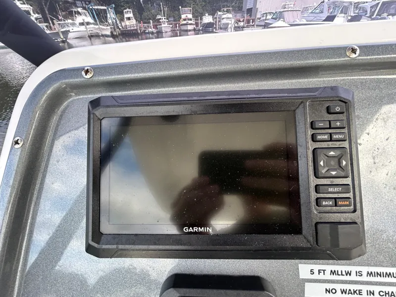Slide: The Image of Garmin navigation system on 2025 Grand Inflatables G850 boat dashboard. - 16