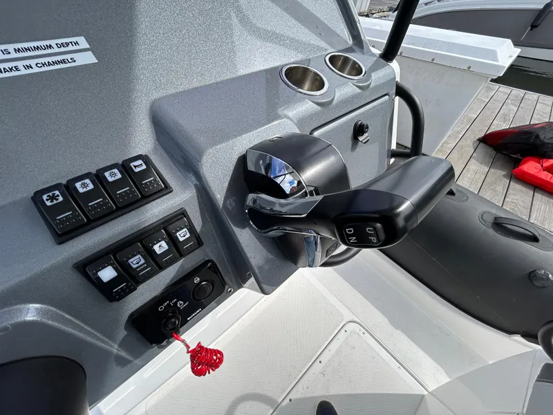Slide: The Image of Control panel of 2025 Grand Inflatables G850 boat with throttle and switches. - 18
