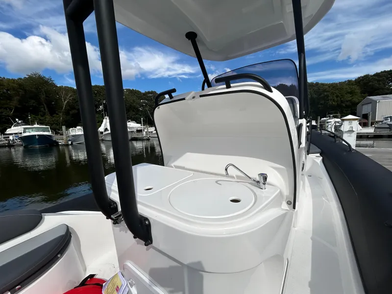 Slide: The Image of 2025 Grand Inflatables G850 boat with sleek design at marina. - 28