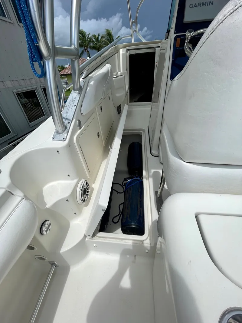 Slide: The Image of 2005 Hydra-Sports Vector 3300 VX boat interior with storage compartments and seating. - 10