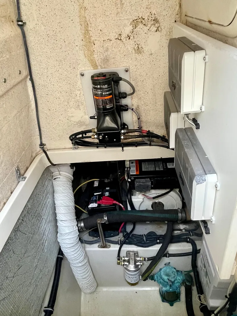 Slide: The Image of 2005 Hydra-Sports Vector 3300 VX engine compartment with wiring and components. - 13