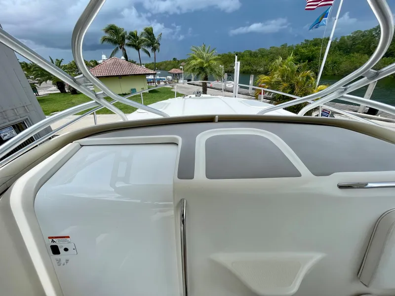 Slide: The Image of 2005 Hydra-Sports Vector 3300 VX boat deck with tropical backdrop and palm trees. - 15