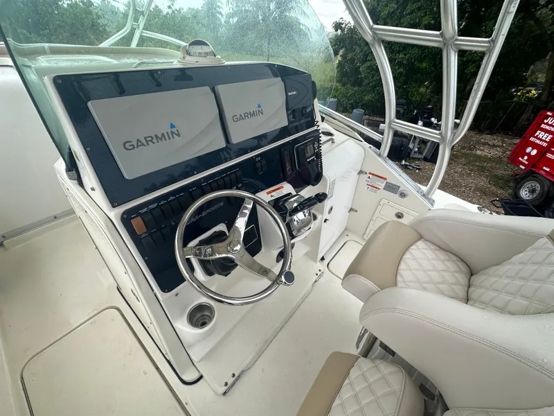 Slide: The Image of 2005 Hydra-Sports Vector 3300 VX helm with Garmin displays and cushioned seating. - 21