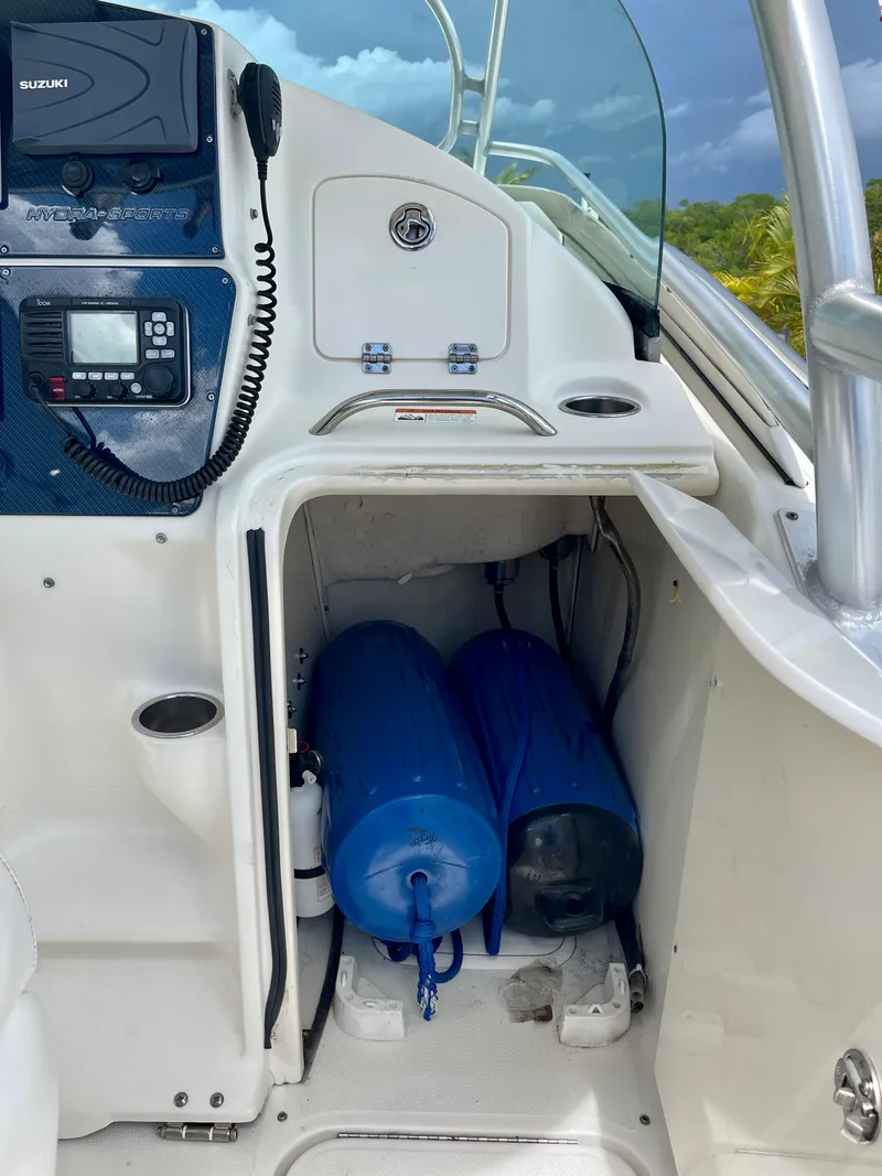 Slide: The Image of 2005 Hydra-Sports Vector 3300 VX boat interior with storage compartment and marine equipment. - 8