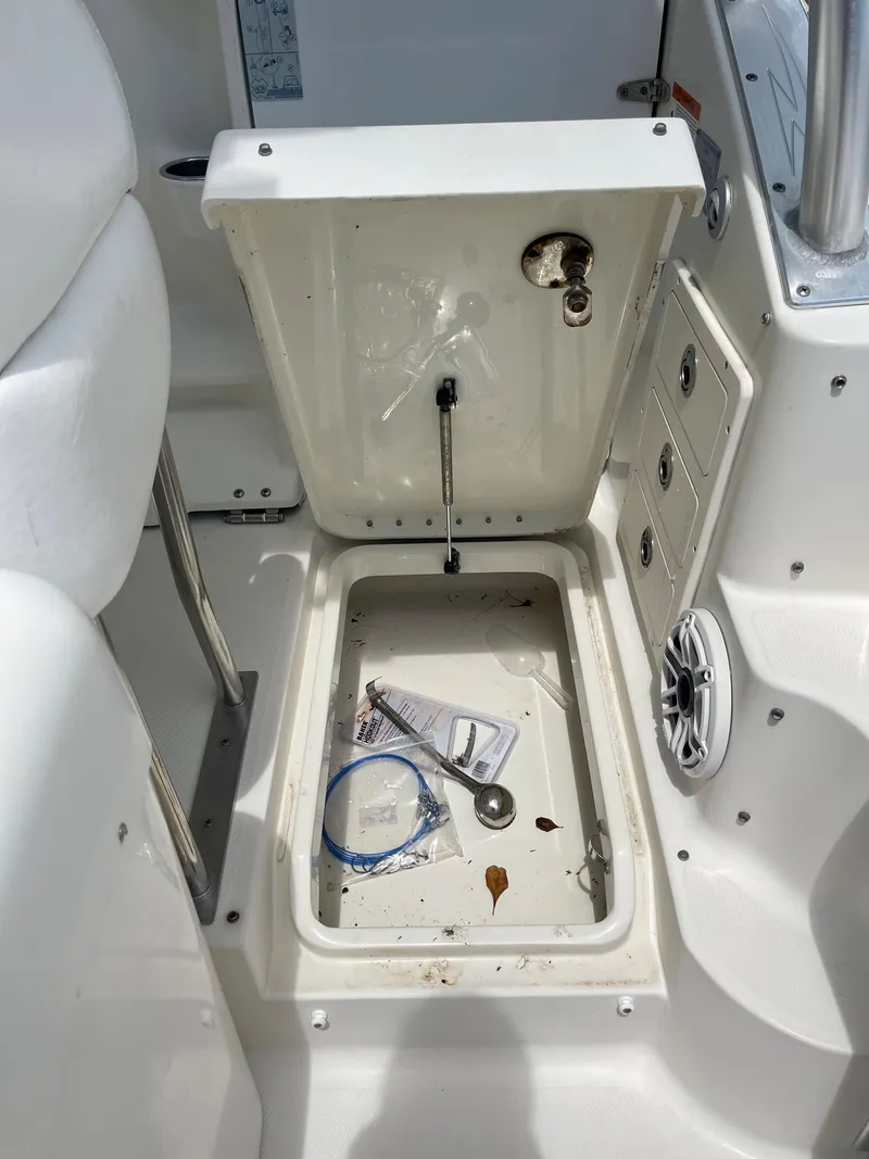 Slide: The Image of Open storage compartment on 2005 Hydra-Sports Vector 3300 VX boat. - 9