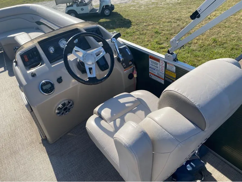 Slide: The Image of 2017 Bennington 22 SLX boat interior with steering wheel and control panel. - 11