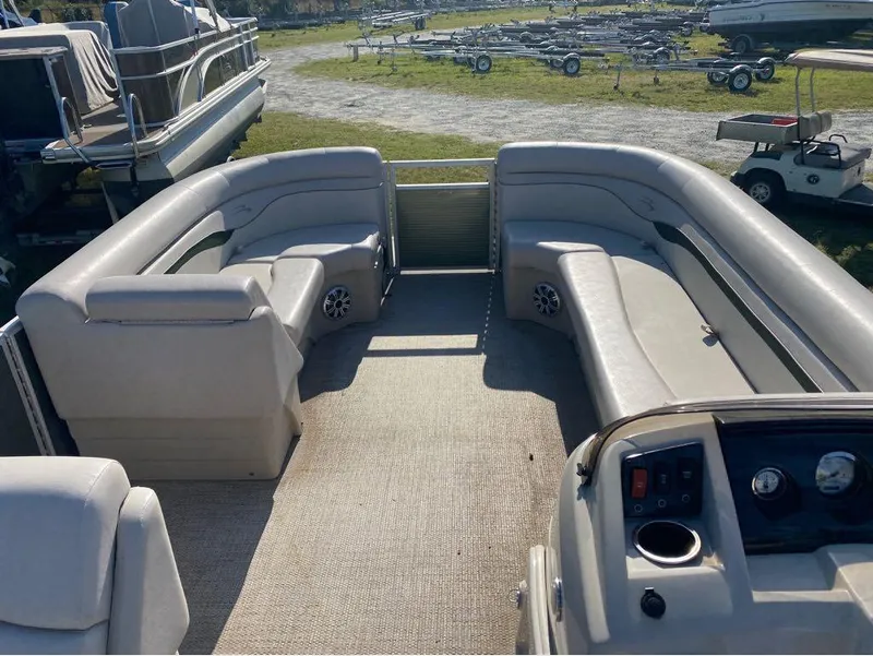 Slide: The Image of 2017 Bennington 22 SLX pontoon boat interior with spacious seating and control panel. - 5