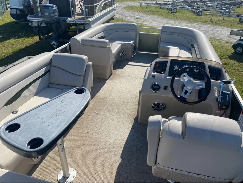 Slide: The Image of 2017 Bennington 22 SLX pontoon boat interior with seating and steering console. - 7