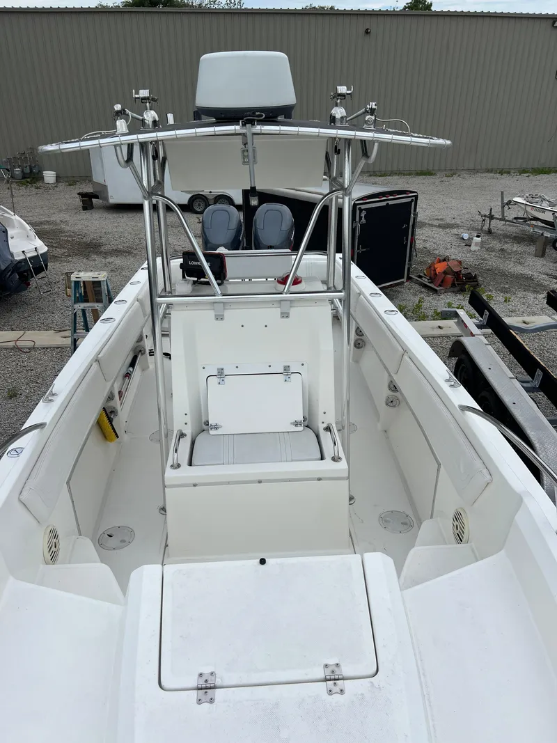 Slide: The Image of 1998 Fountain 31 CC boat with center console and seating, parked outdoors. - 14