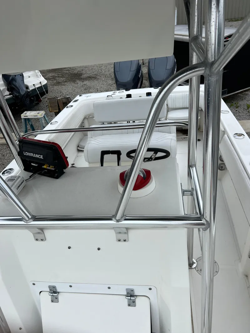 Slide: The Image of 1998 Fountain 31 CC boat interior with steering wheel and navigation equipment. - 15