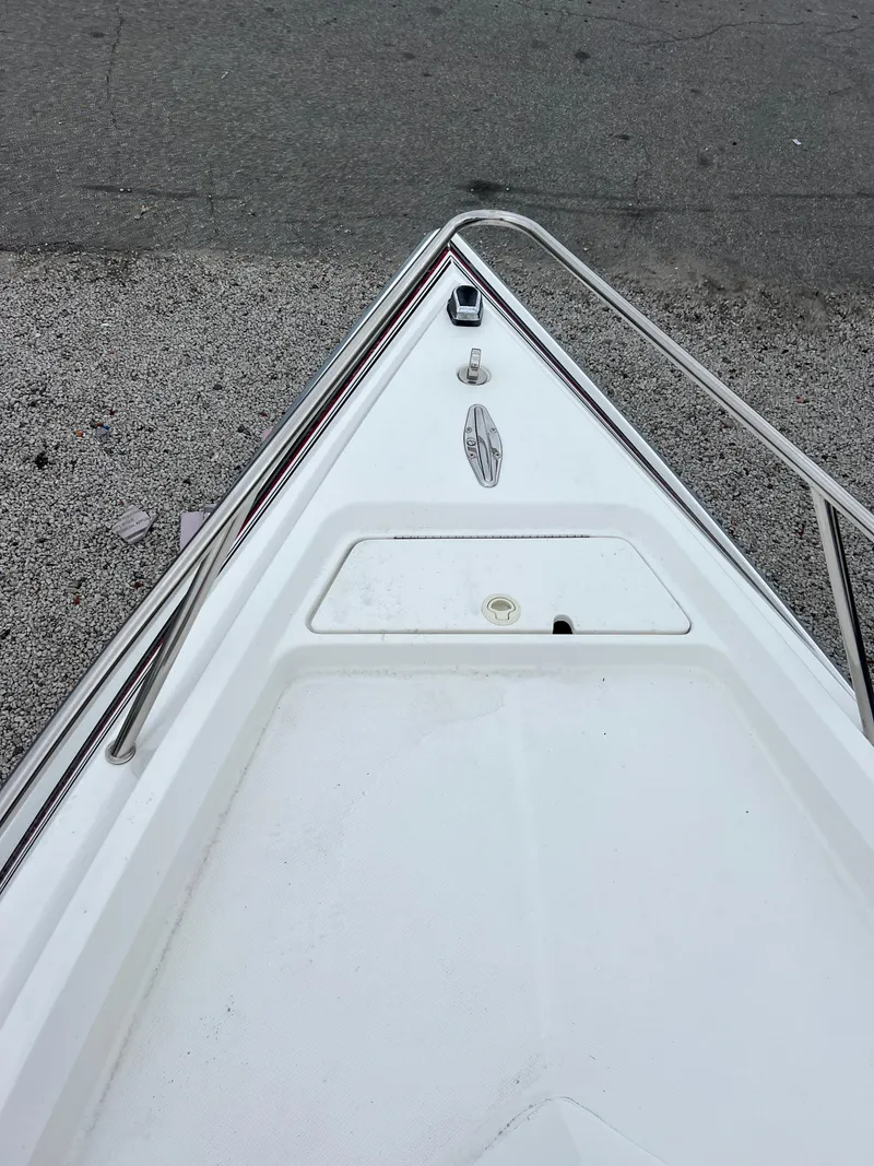Slide: The Image of Bow of a 1998 Fountain 31 CC boat with stainless steel railings. - 17