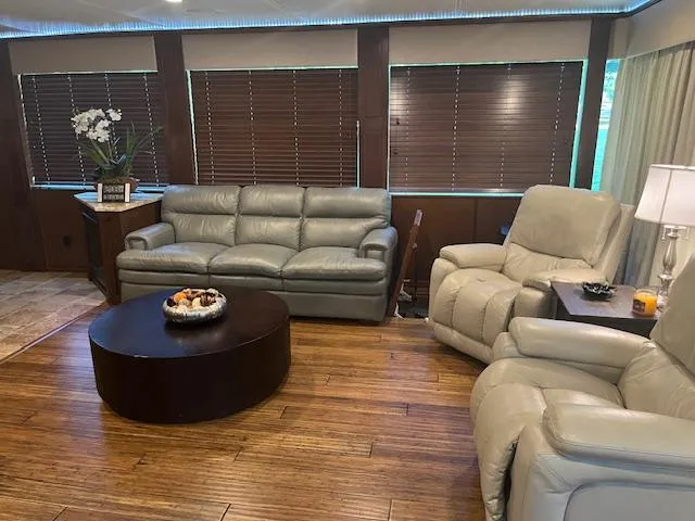 Slide: The Image of Luxurious 2010 Stardust Cruisers houseboat interior with leather seating and wooden flooring. - 11