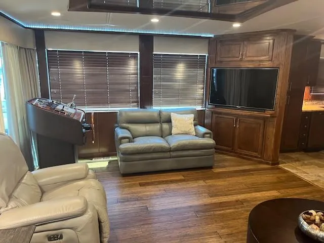 Slide: The Image of Luxurious 2010 Stardust Cruisers houseboat interior with leather seating and modern entertainment system. - 12