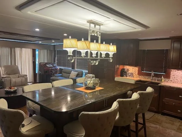 Slide: The Image of Luxurious 2010 Stardust Cruisers houseboat interior with modern kitchen and elegant dining area. - 14