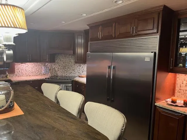 Slide: The Image of Luxurious 2010 Stardust Cruisers houseboat kitchen with modern appliances and elegant cabinetry. - 17