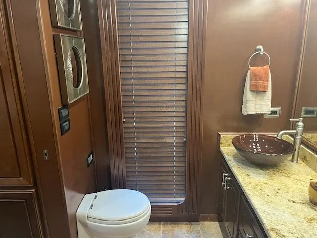 Slide: The Image of Luxurious bathroom in 2010 Stardust Cruisers houseboat with modern fixtures and wooden accents. - 21