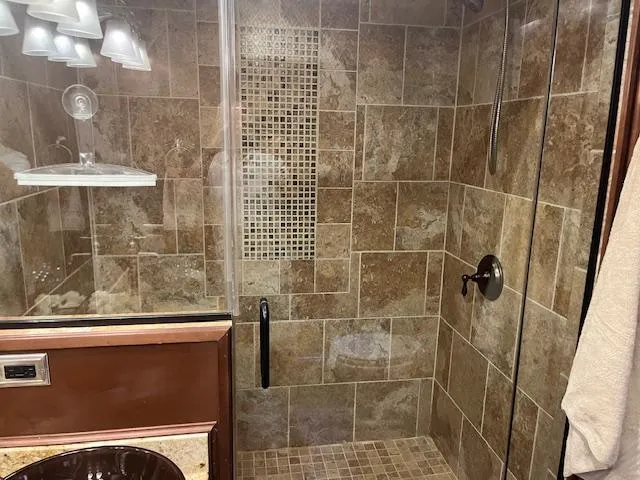 Slide: The Image of Luxurious tiled shower in 2010 Stardust Cruisers houseboat bathroom. - 23