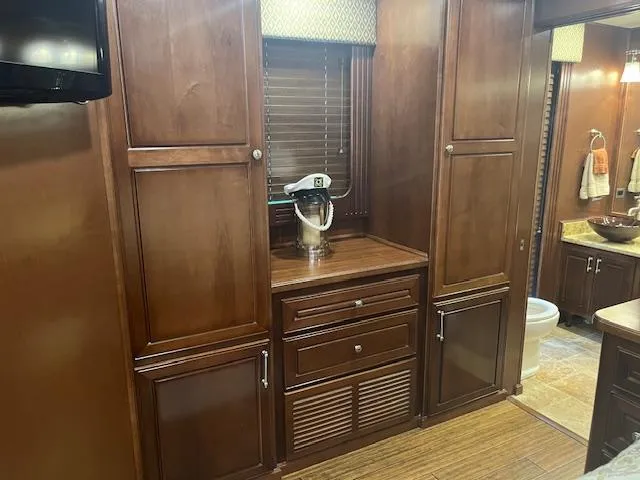 Slide: The Image of Luxurious 2010 Stardust Cruisers houseboat interior with wooden cabinets and modern kitchen amenities. - 24